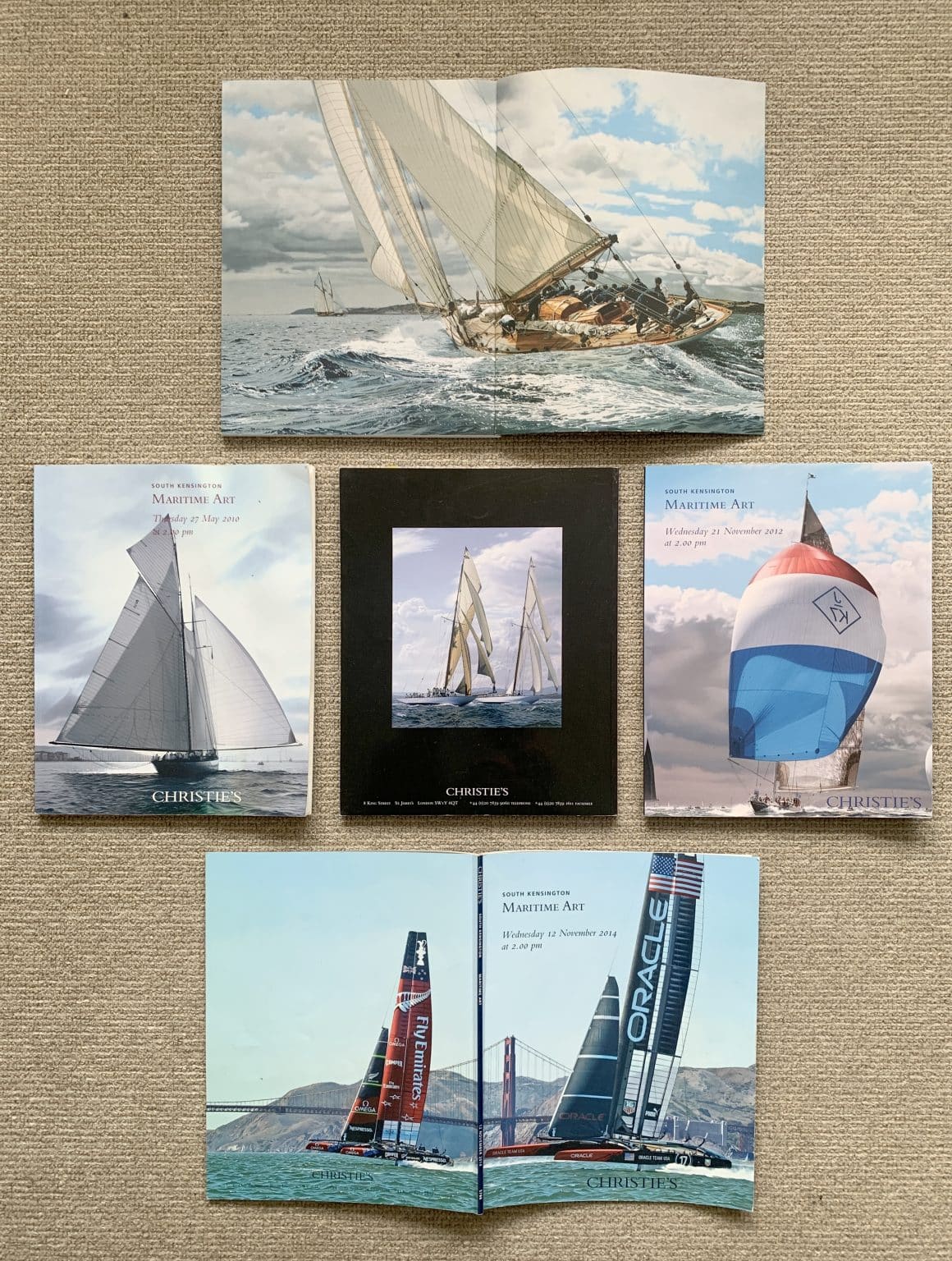 Christie's maritime auction catalogues featuring Jamie Medlin paintings on three front covers