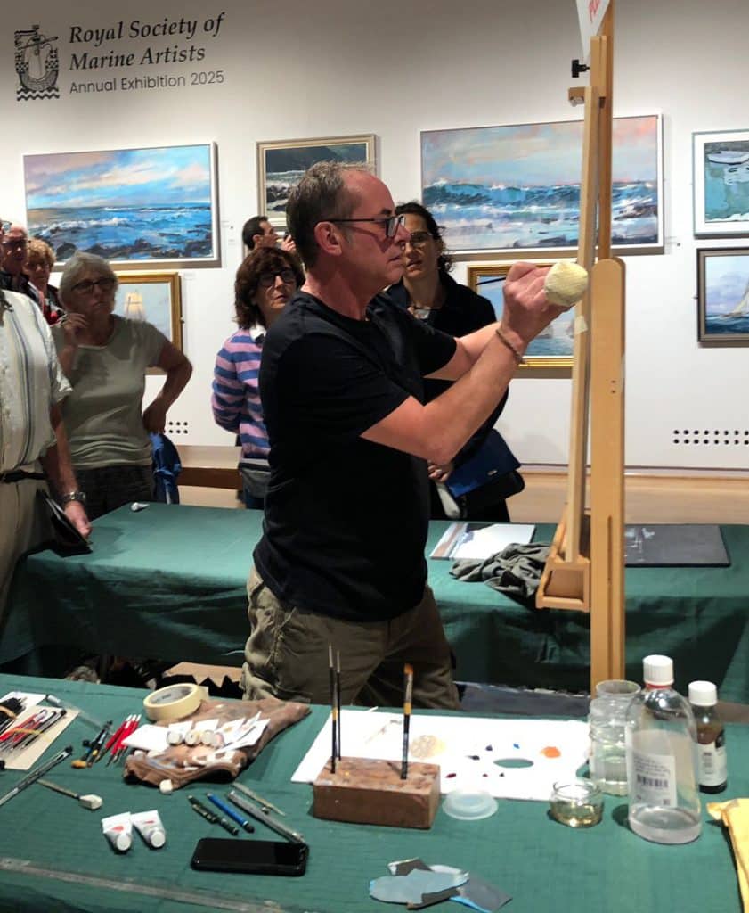 Jamie Medlin demonstrating his marine painting technique to visitors
