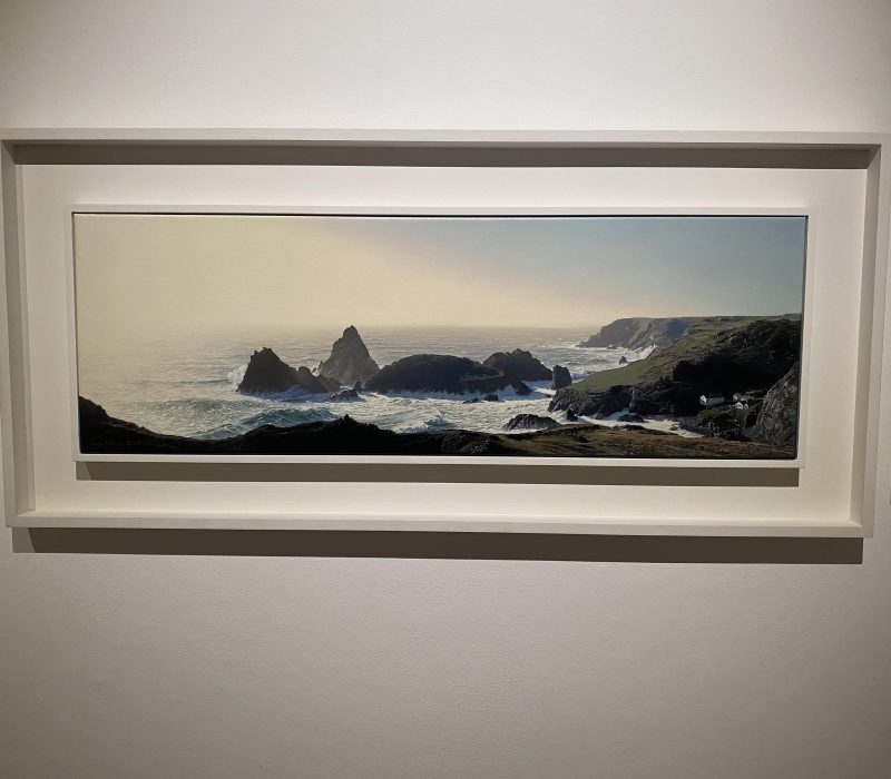 Framed panoramic Cornish coastal painting by Jamie Medlin in a gallery setting