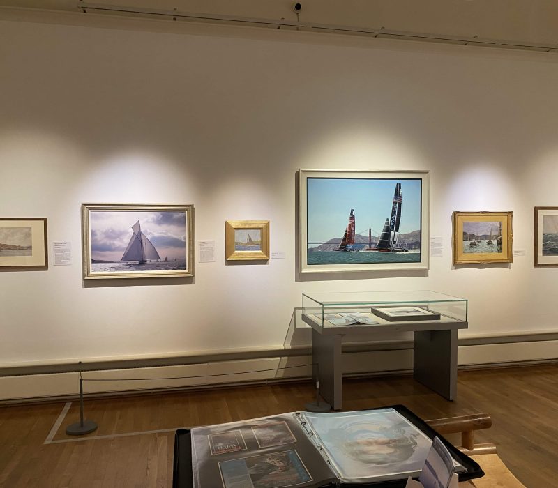 Exhibition room hung with framed seascapes by Cornish marine artist Jamie Medlin